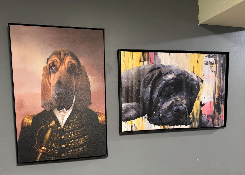 Two framed custom pet portraits displayed together on a wall