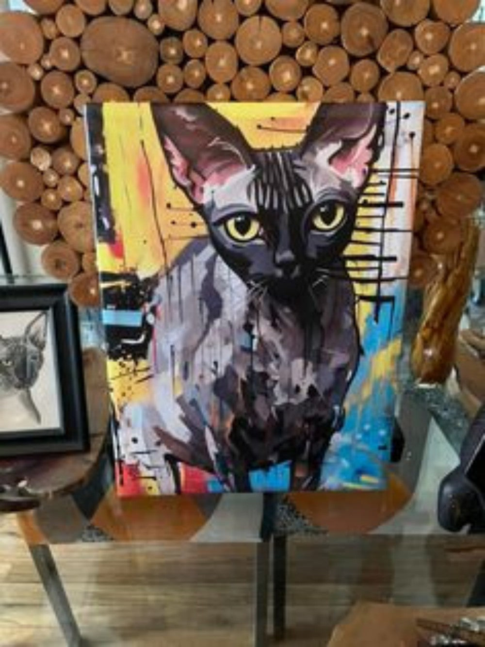 Physical custom pet portrait canvas in a display setting